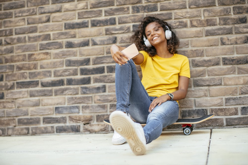 Young african woman outdoors. Beautiful young woman enjoying outdoor.