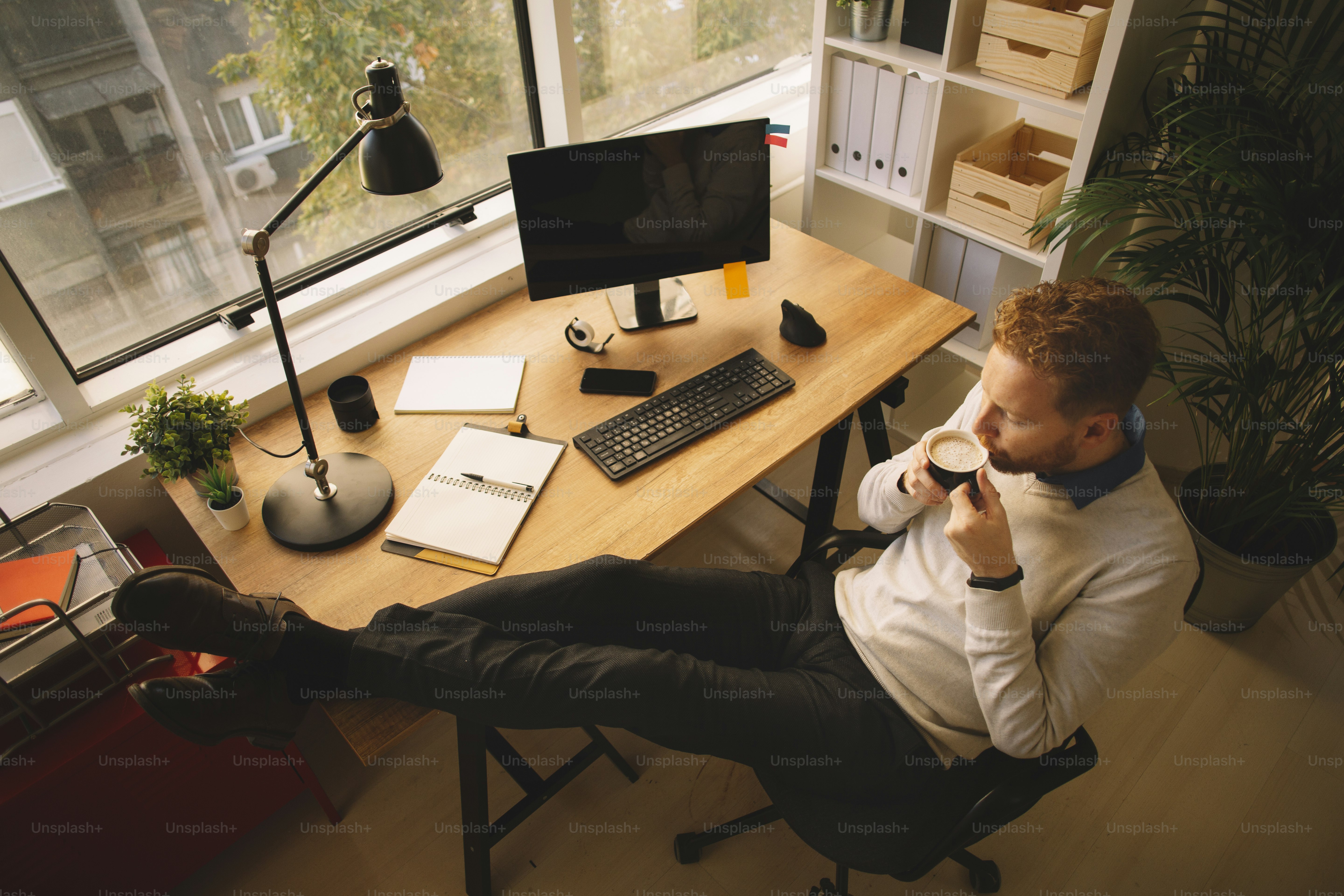 Young businessman having fun in office. Handsome man working in office.