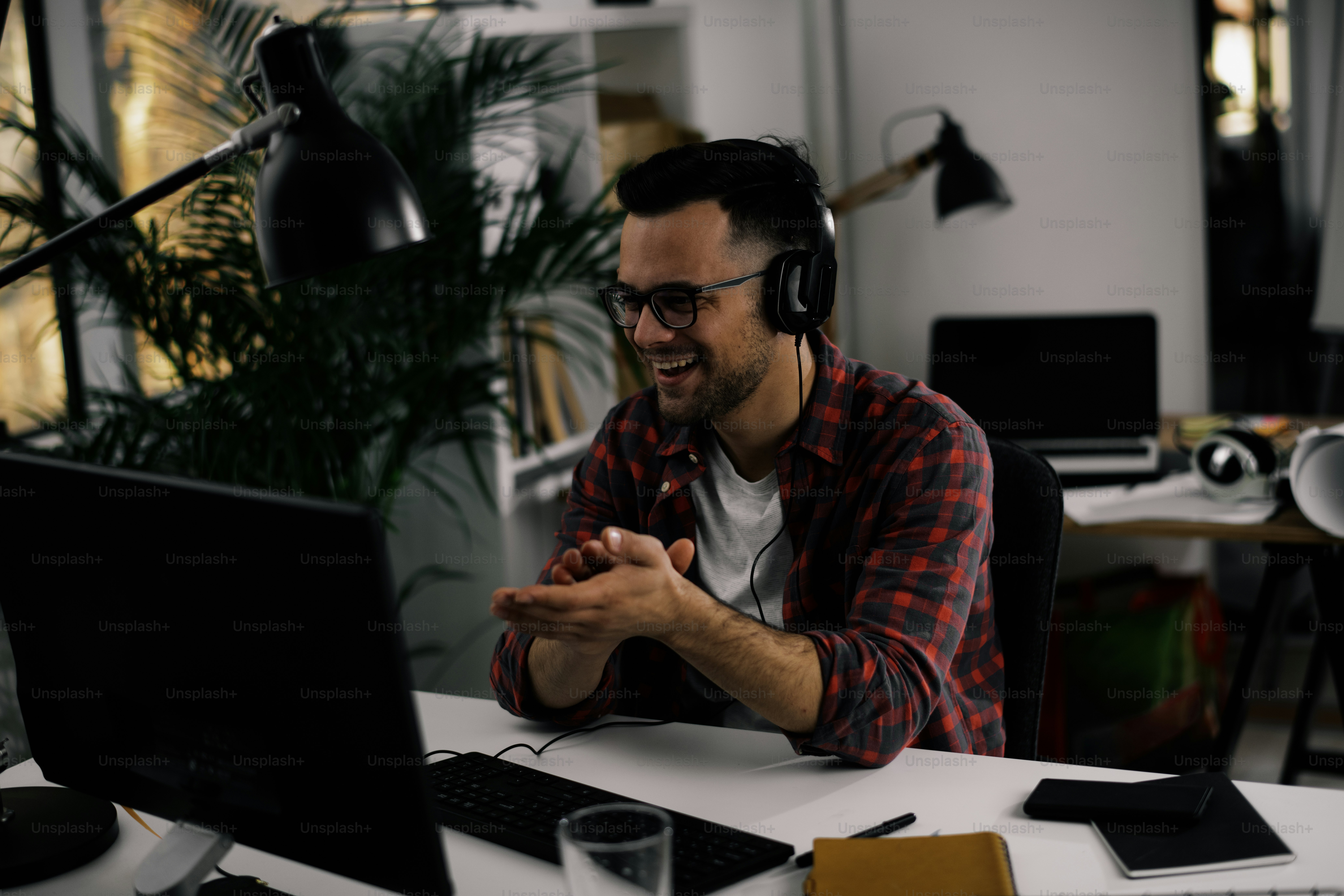 Young businessman working in office. Haandsome man working on lap top.