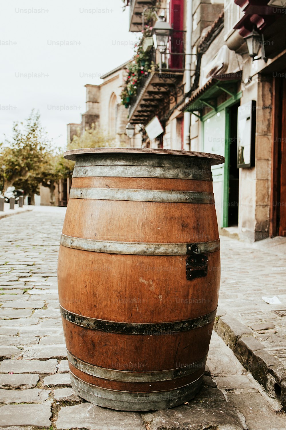 wooden barrel table at a bar or pub in the city