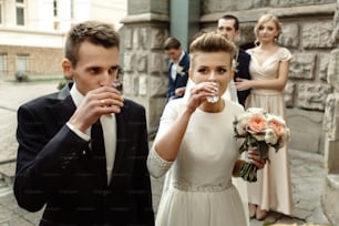 happy bride and groom toasting and laughing, funny moment,  gorgeous wedding reception