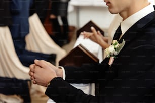 bride and groom preparing for communion on knees at wedding ceremony in church