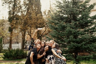 stylish elegant women taking funny selfie at celebration sunny in park, luxury happy life concept