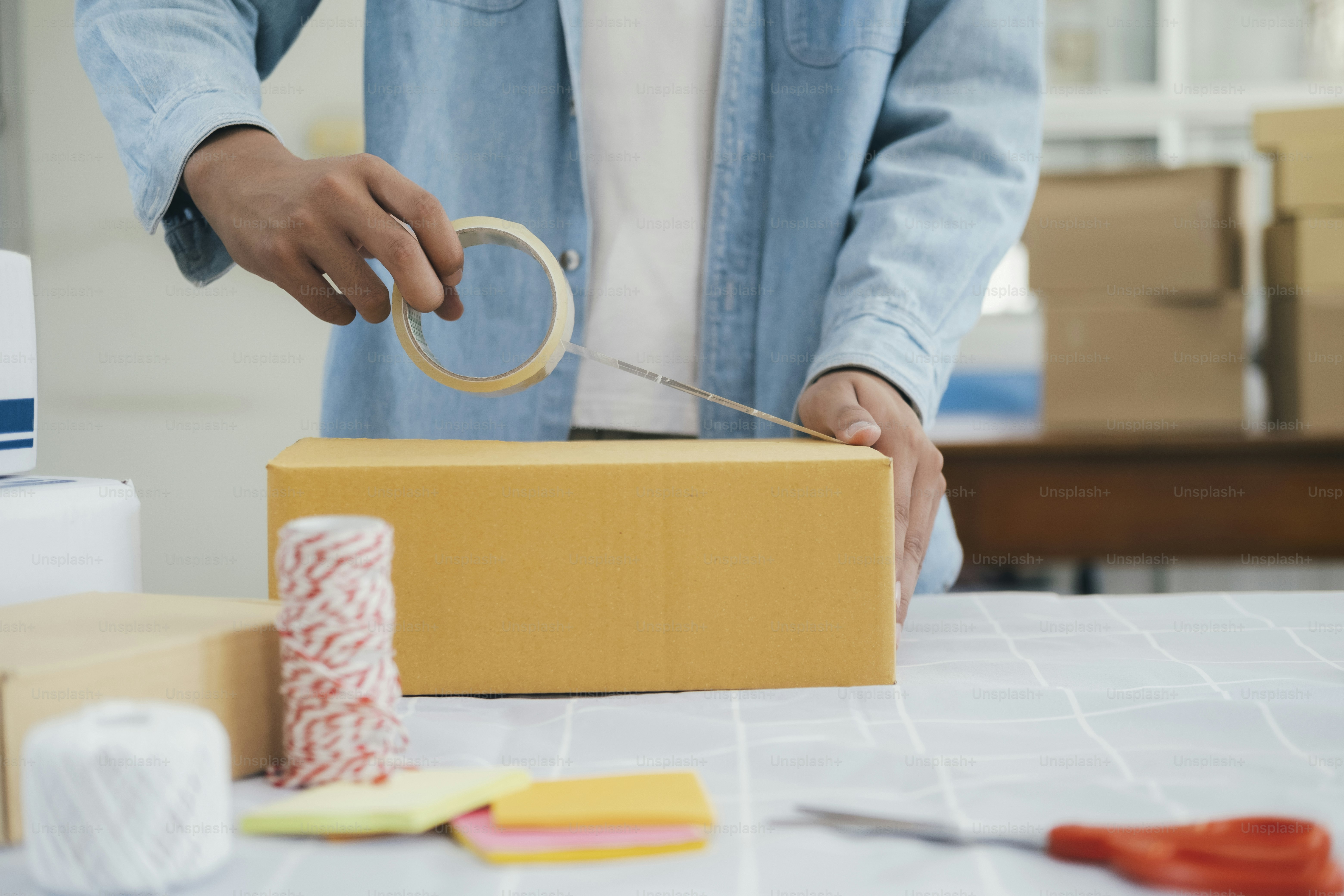 Online small business owner. Young startup entrepreneur online small business owner working at home, packaging and delivery situation.