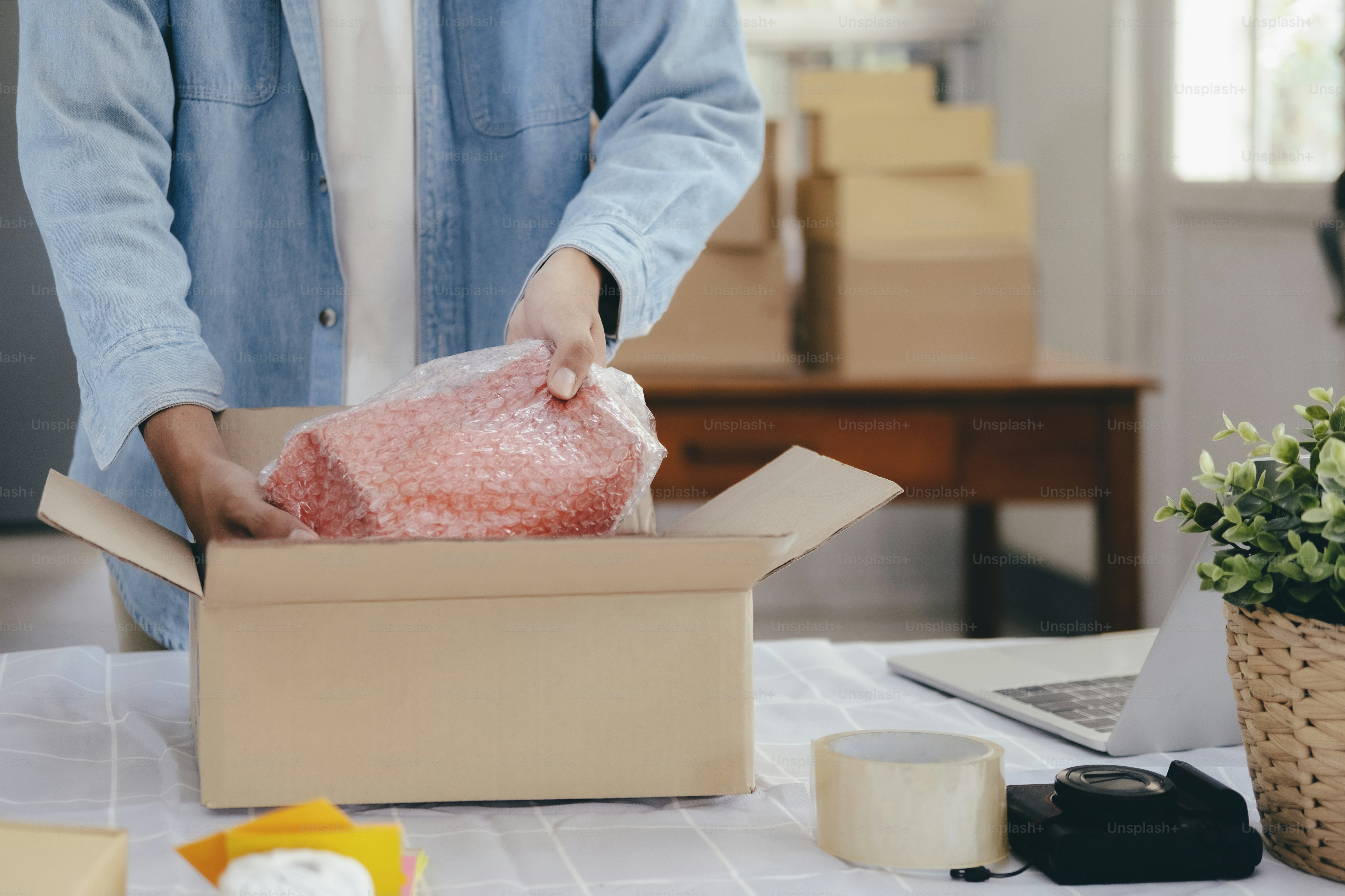 Online small business owner. Young startup entrepreneur online small business owner working at home, packaging and delivery situation.