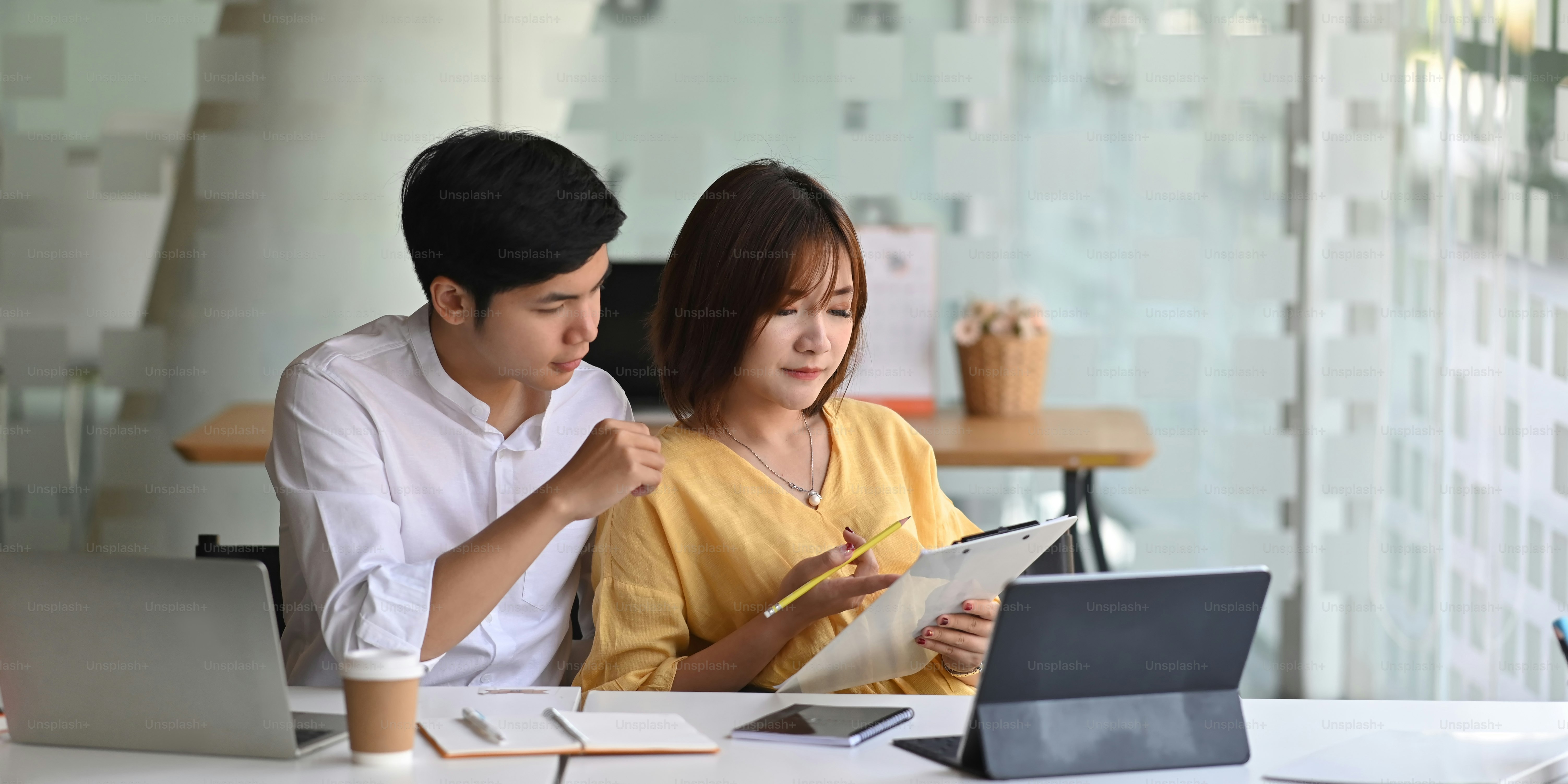 Cropped image of business people meeting with computer tablet and ...