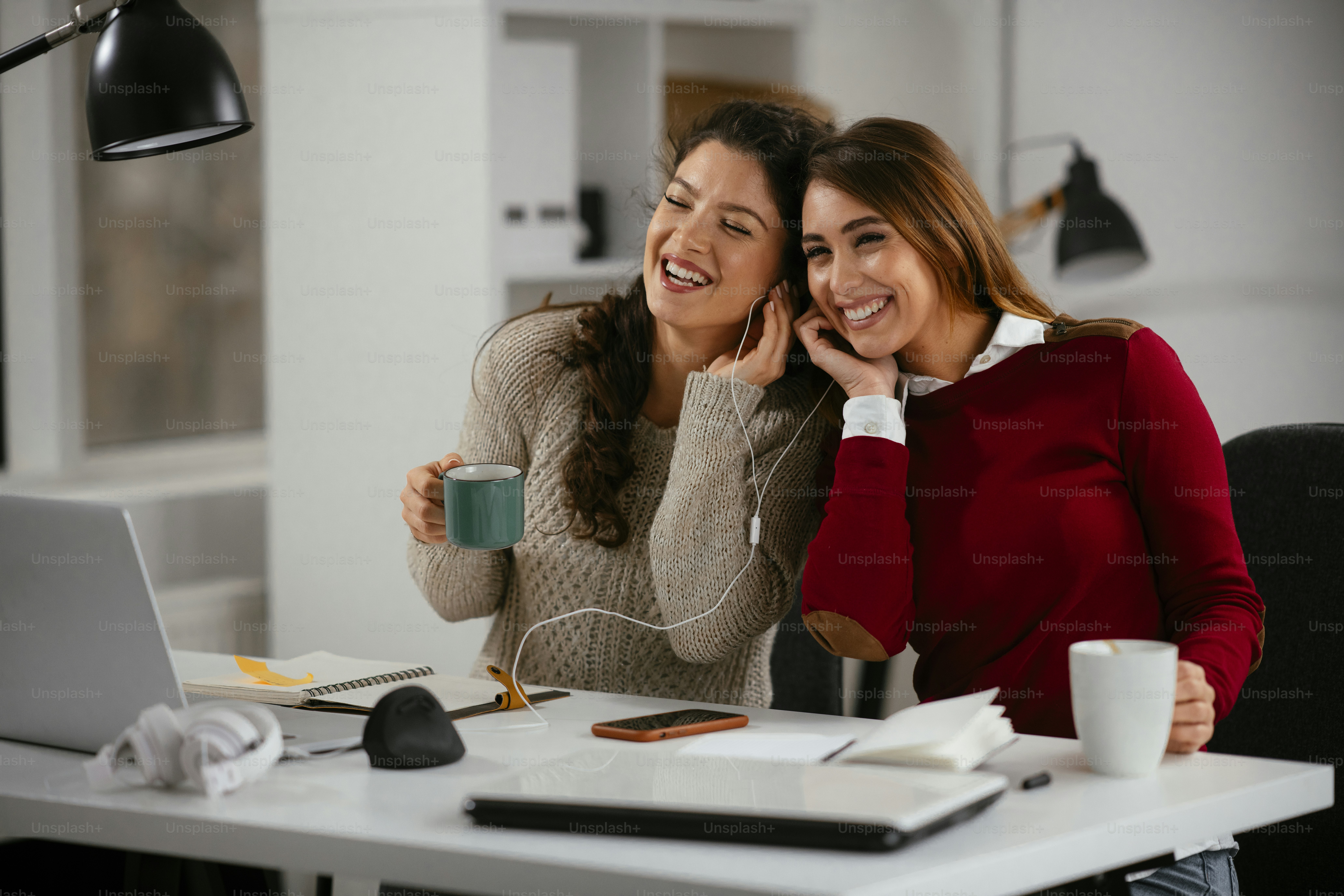 Two best friends working together in office. Girlfriends having fun ...