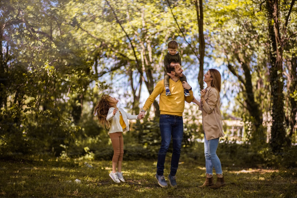 Time spent with family is worth every second. Parents spending time with their children outside.