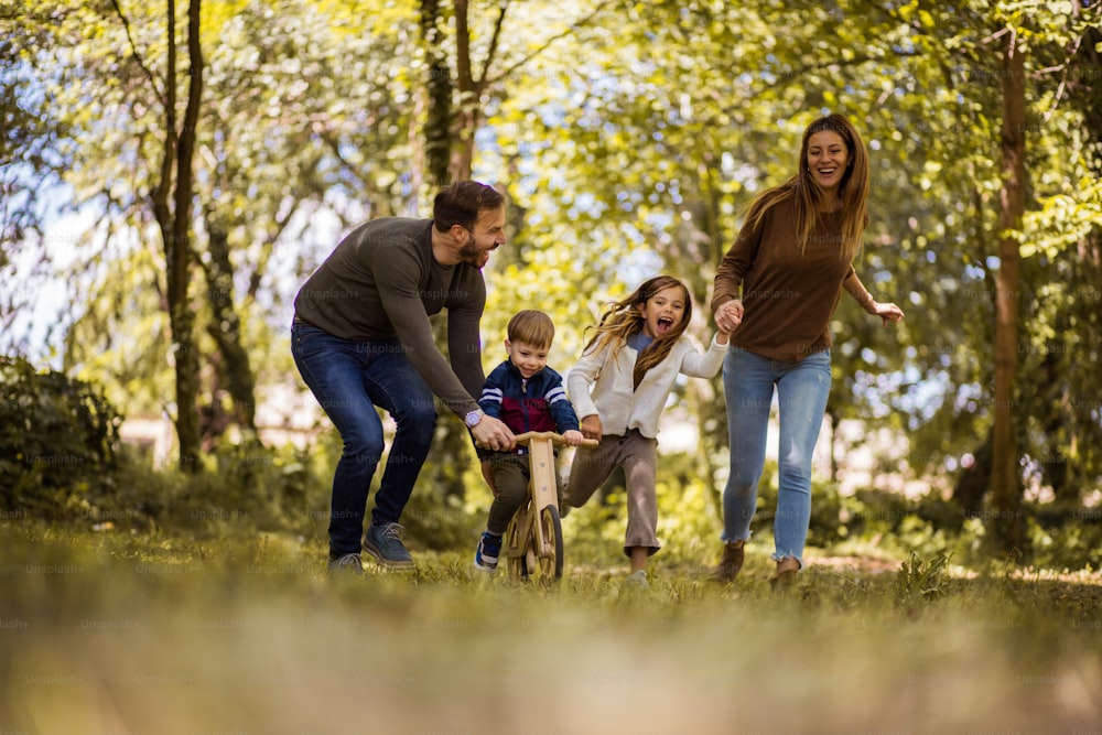 The nature offers so much fun for the whole family.  Parents spending time with their children outside.