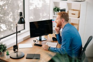 Young businessman working in office. Handsome man enjoying at work