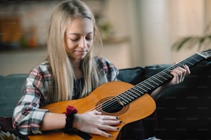 Young girl with guitar. Little girl posing with guitar.