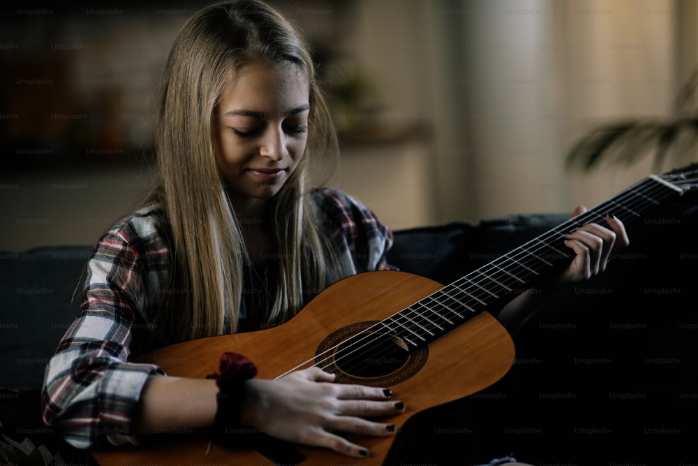 Young girl with guitar. Little girl posing with guitar.