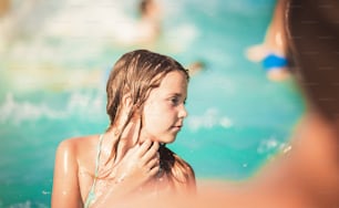 Feel the sun. Child in the pool.