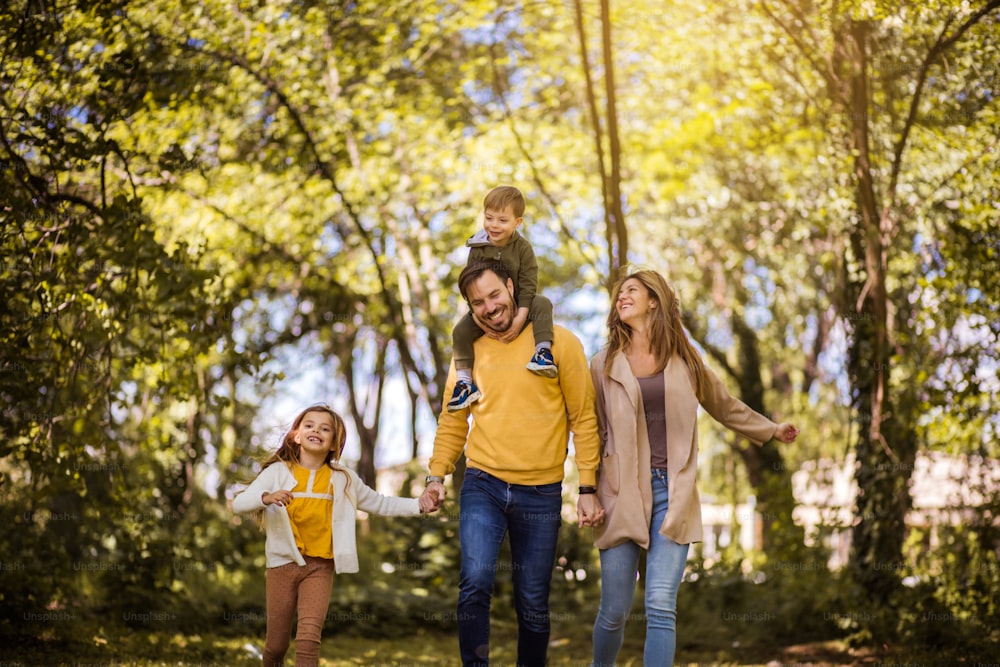 Family fun all summer long. Parents spending time with their children outside.