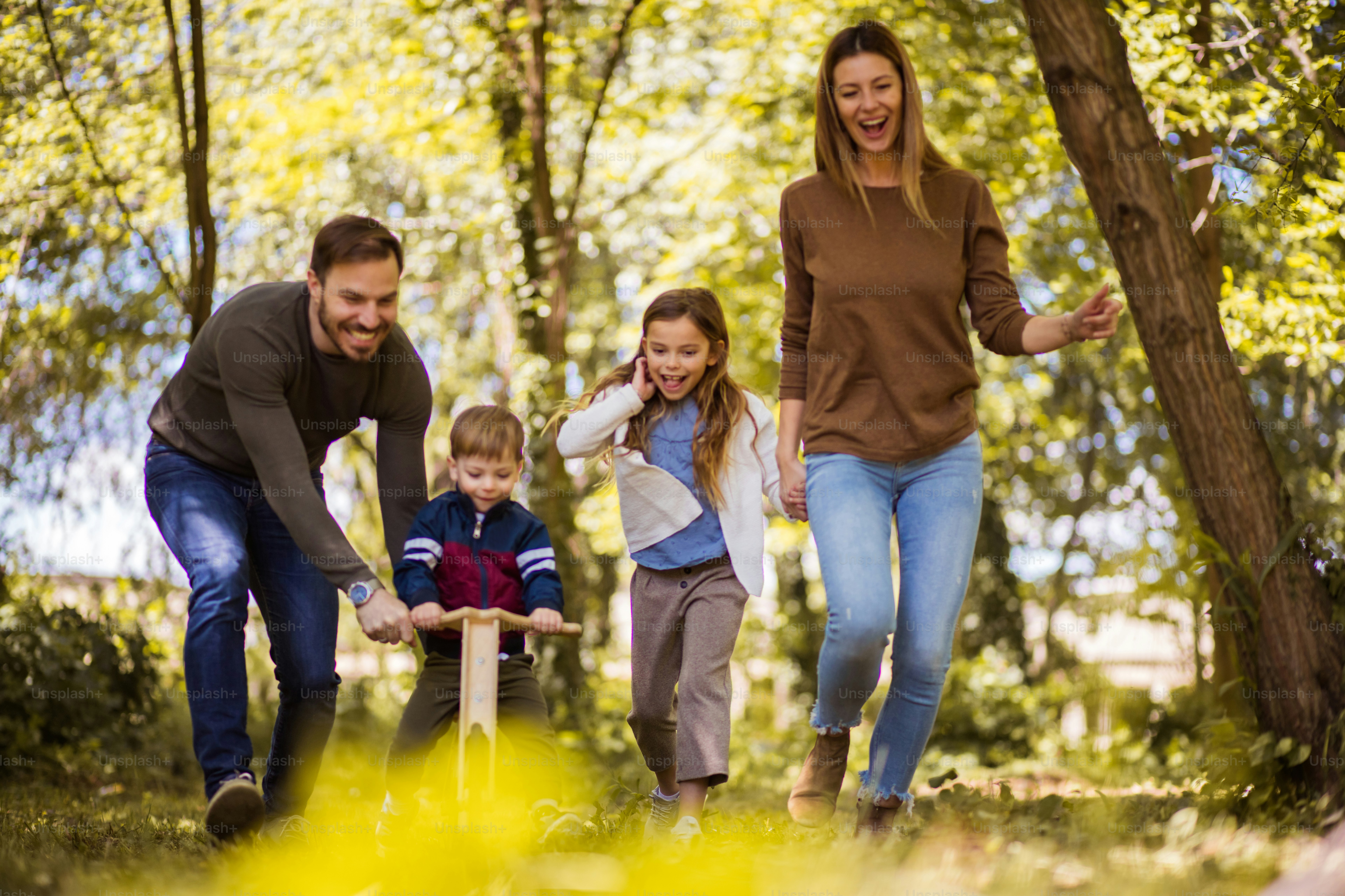 Making Time For The Family. Parents Spending Time With Their Children ...