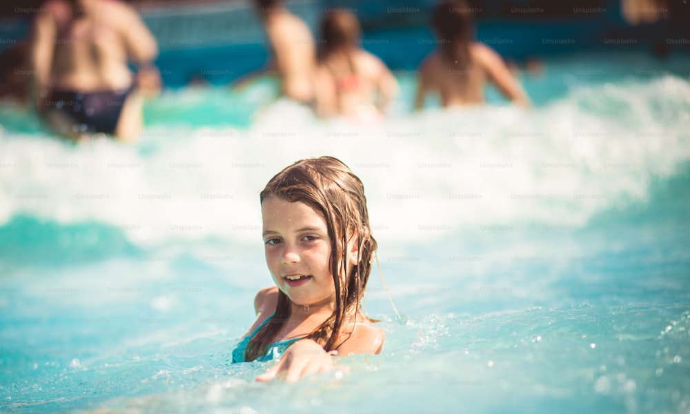 Life of one mermaid. Child swimming in the pool.