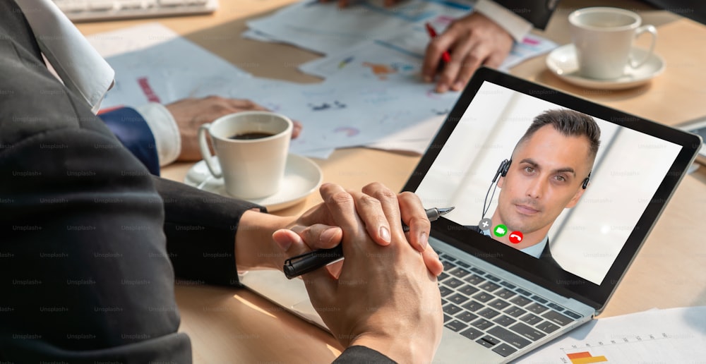 Video call group business people meeting on virtual workplace or remote office. Telework conference call using smart video technology to communicate colleague in professional corporate business.