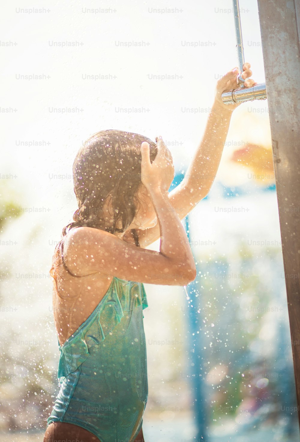 Refreshing. Child showering after pool.