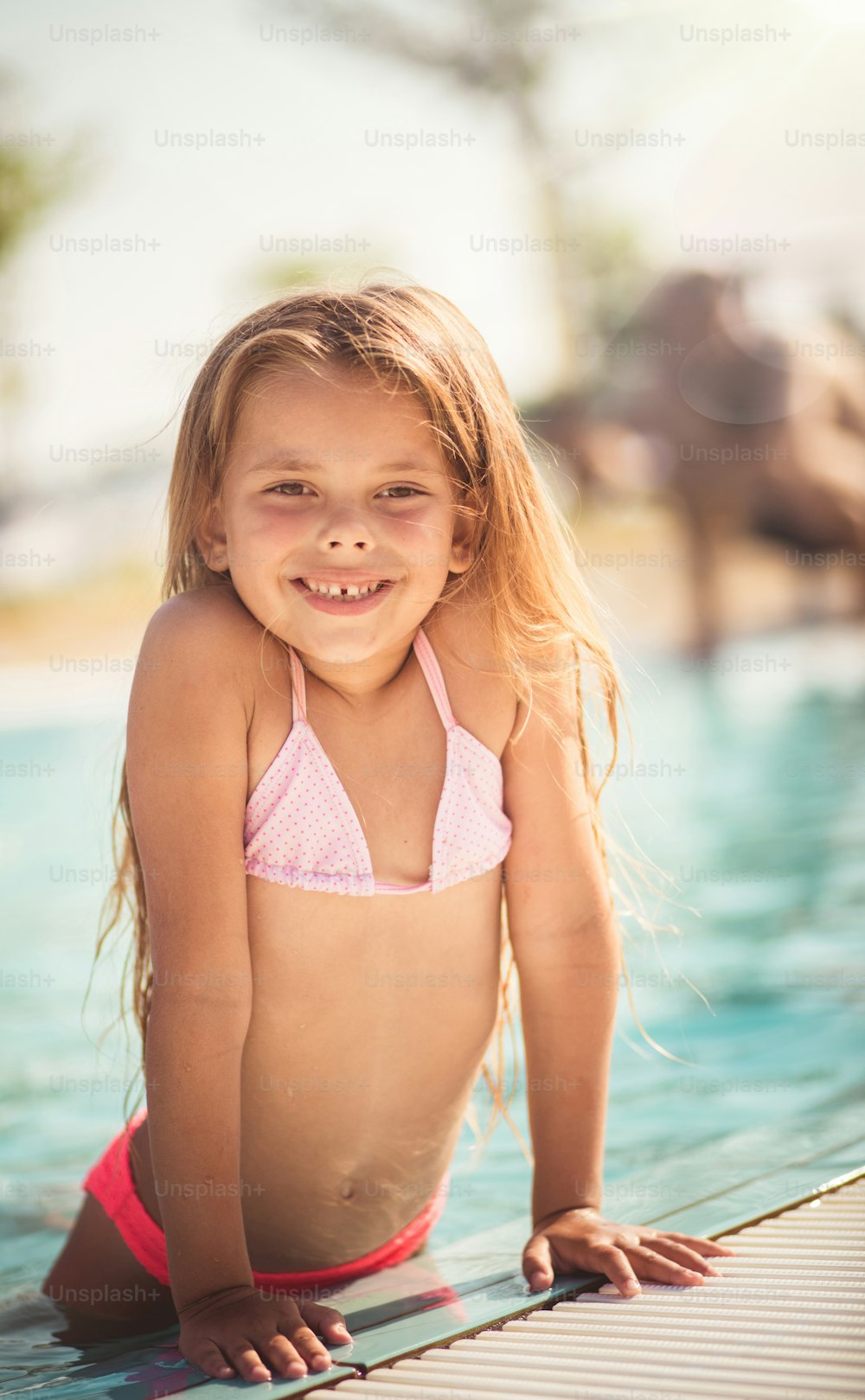 Weekend is created for relax. Child in the pool.