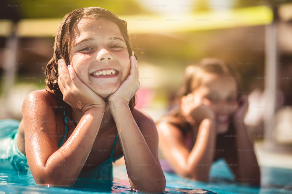 Summer has started. Children in pool.