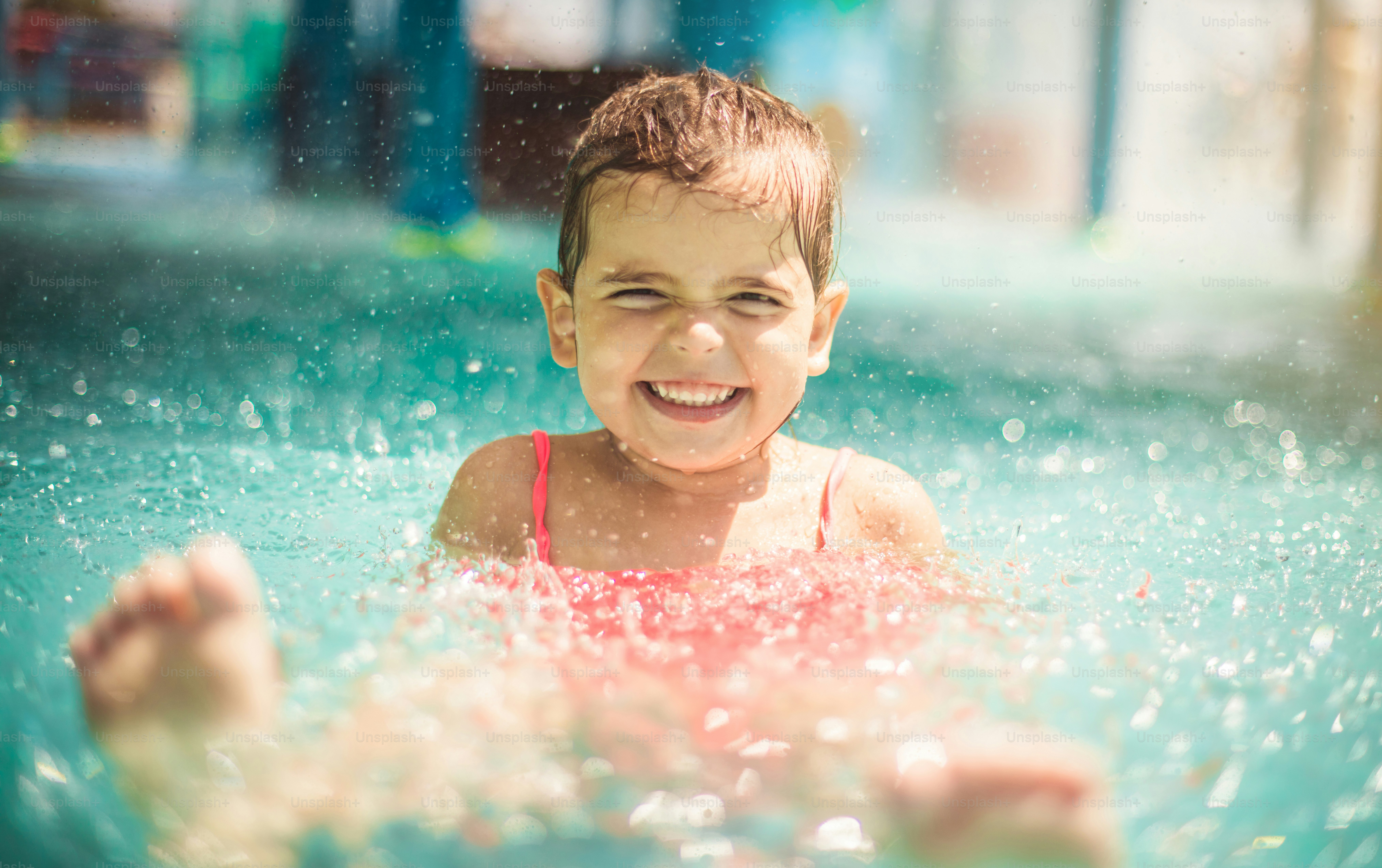 Sunshine and fun. Child having fun in pool. photo – Smiling Image on ...