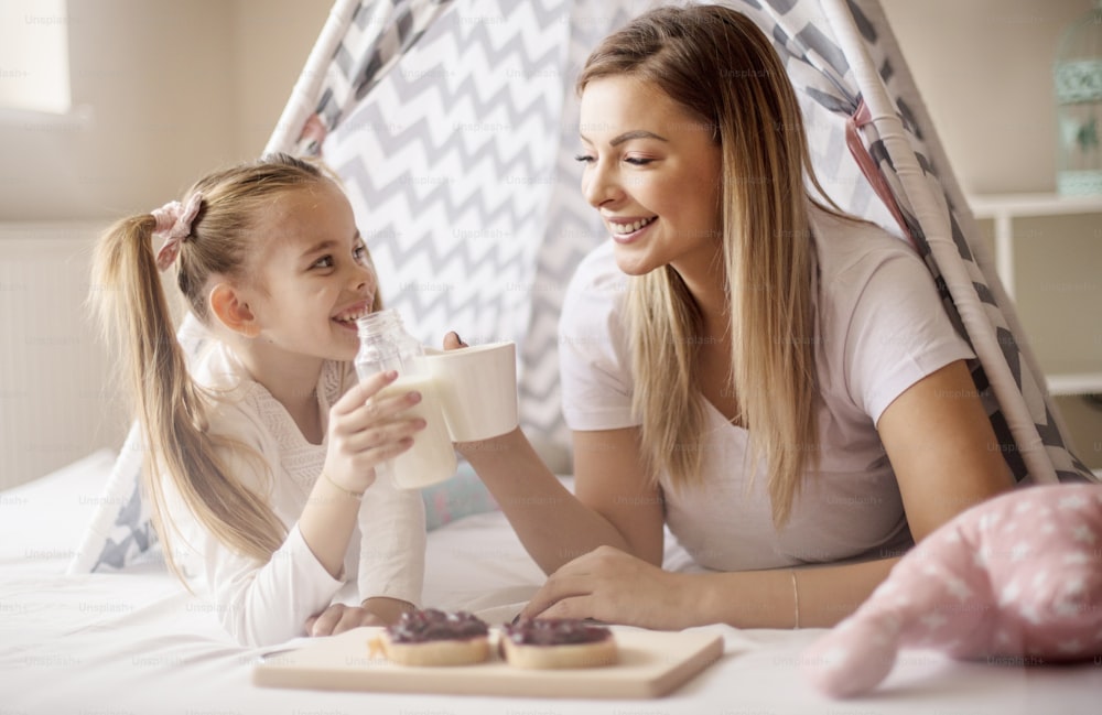 For us girls. Mother and daughter having breakfast in bed.
