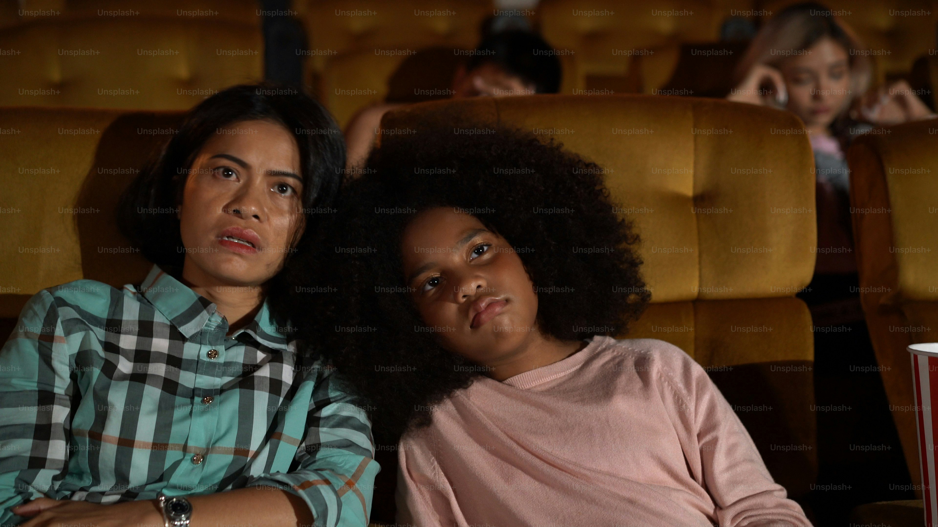 People audience watching movie in the movie theater cinema. Group recreation activity and entertainment concept