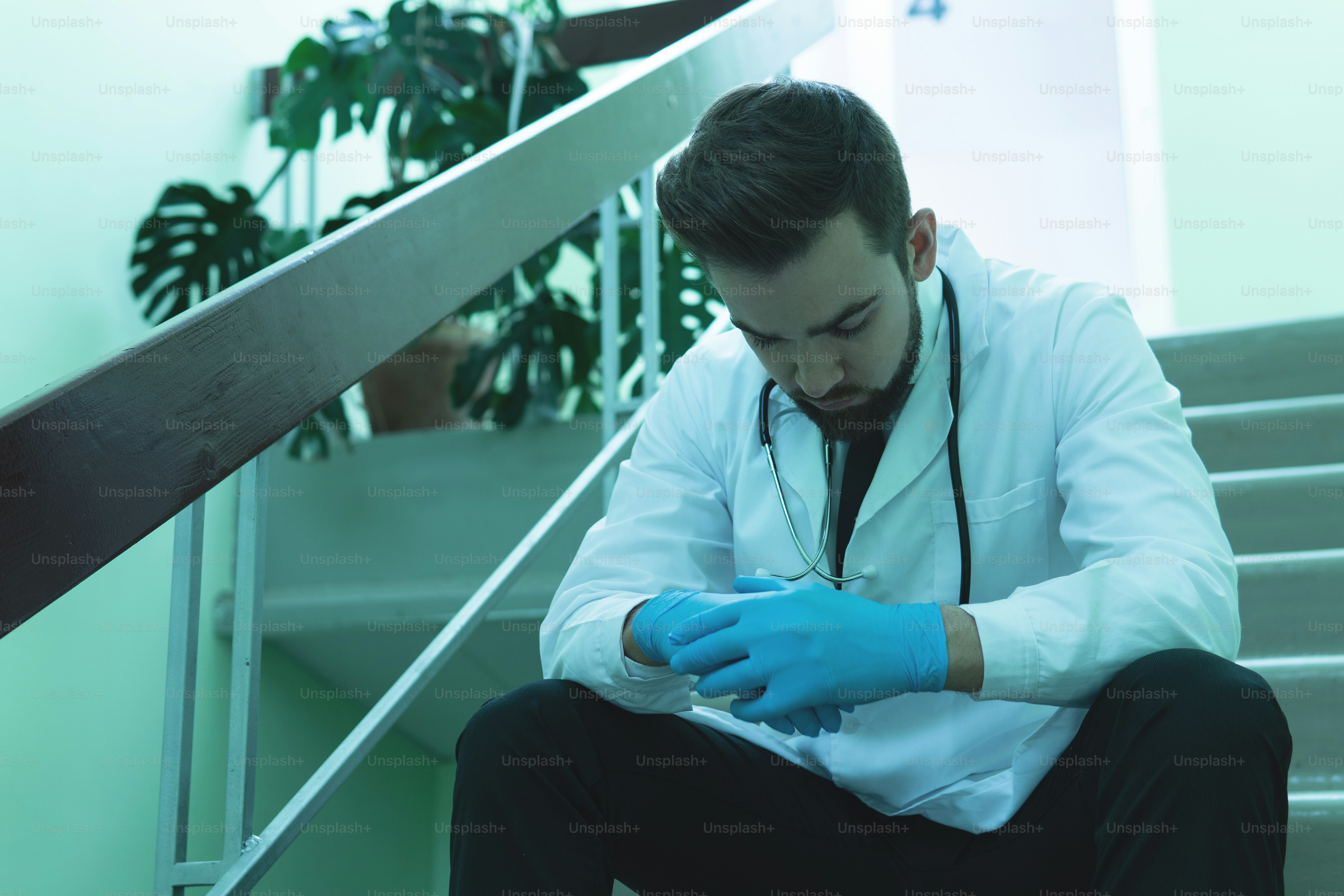 Exhausted doctor after very long shift in the hospital