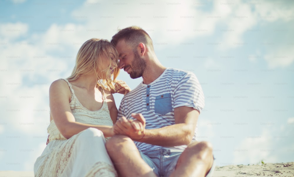 Life is all about who you have beside you. Couple on sand.