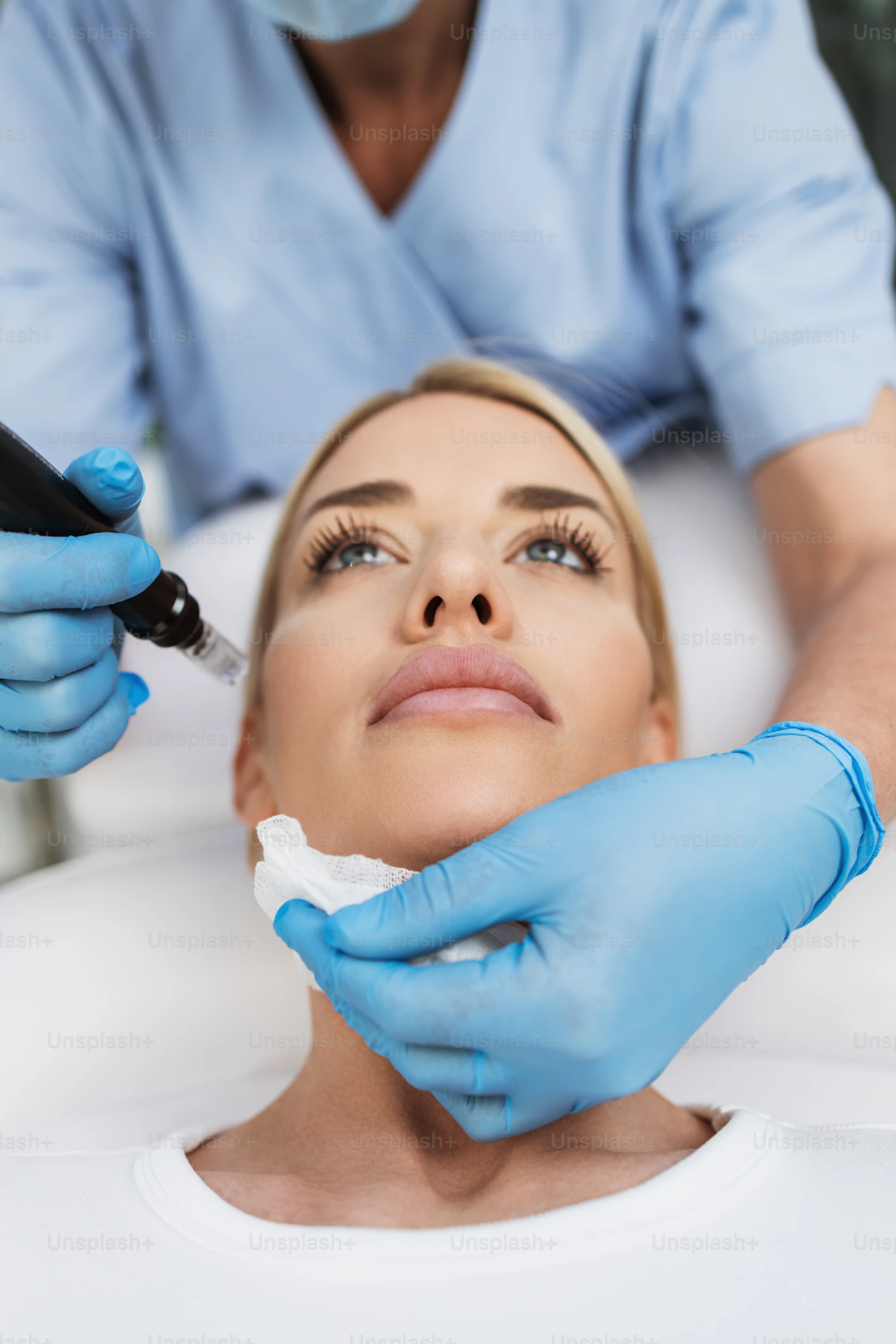 Microdermabrasion diamond-tip wand exfoliating the face in a private studio