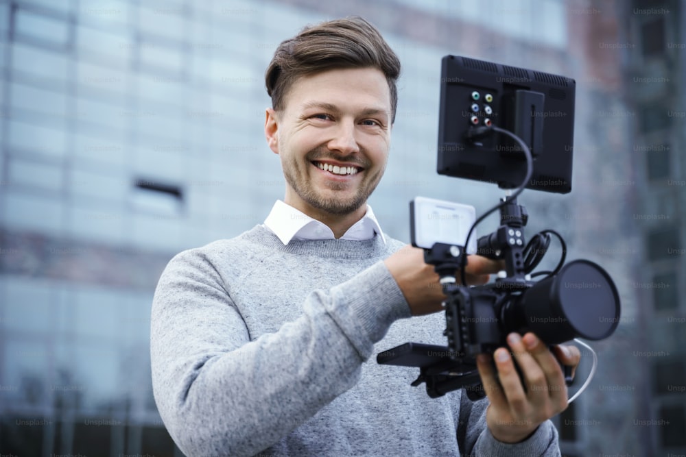 Professional videographer with a modern camera rig for video recording