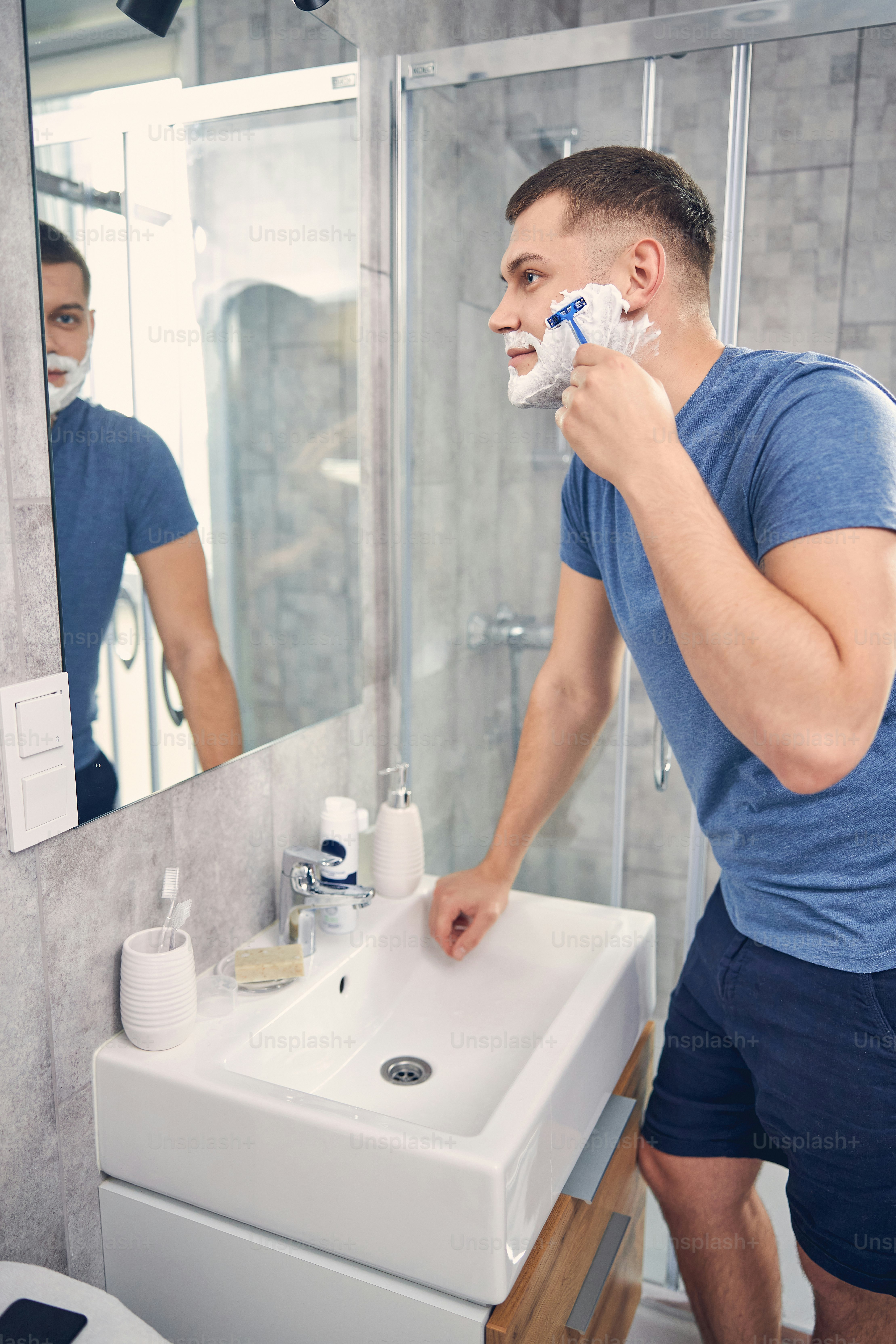 Man shaving carefully during a personal grooming routine