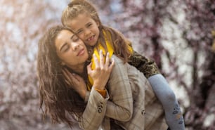 My day with you is wonderful.  African American mother with her daughter at the park.