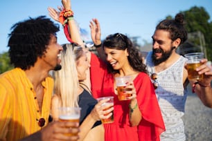 Cheerful group of friends having fun, travelling and smiling