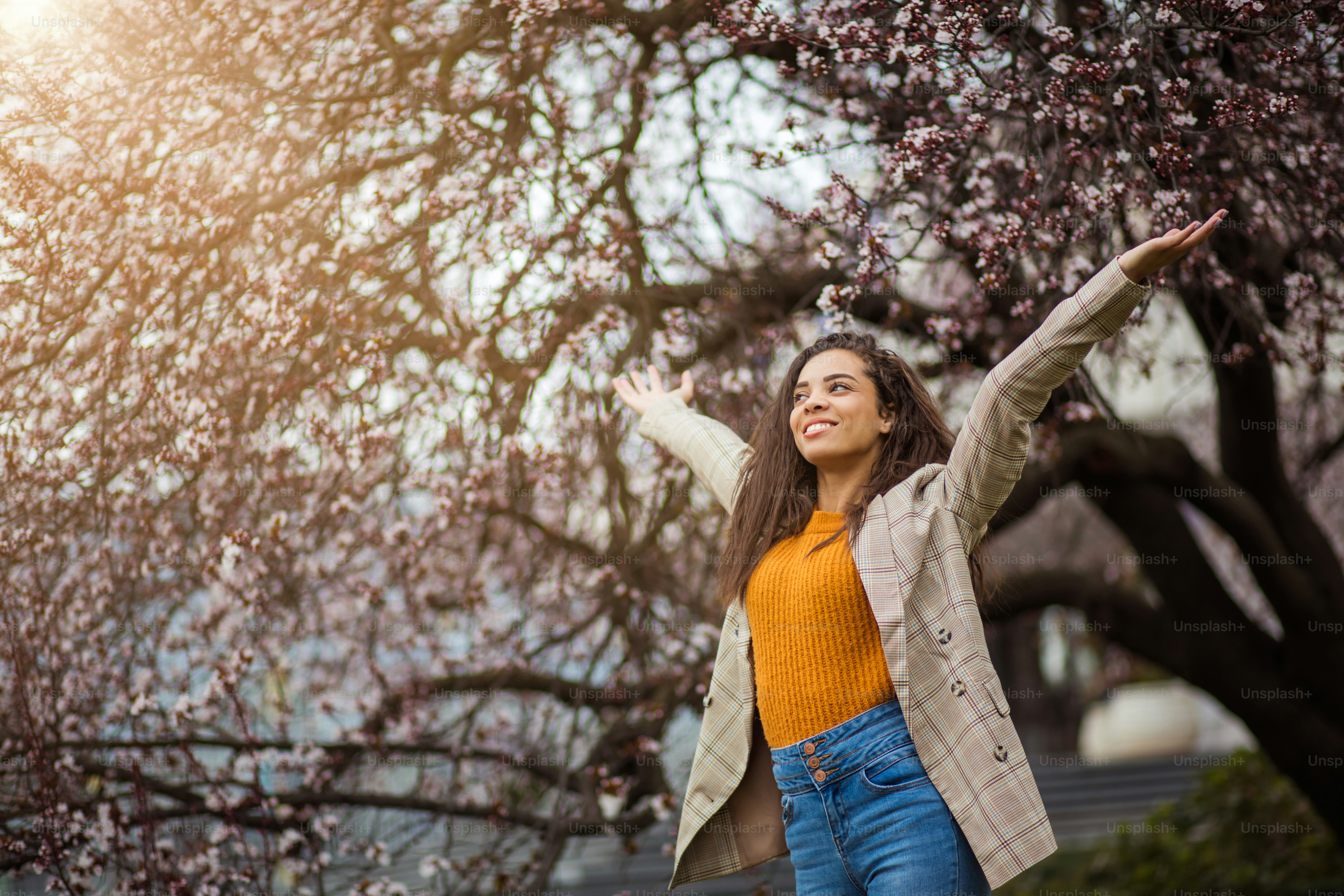 Sun, my friend.  African American woman at the park.