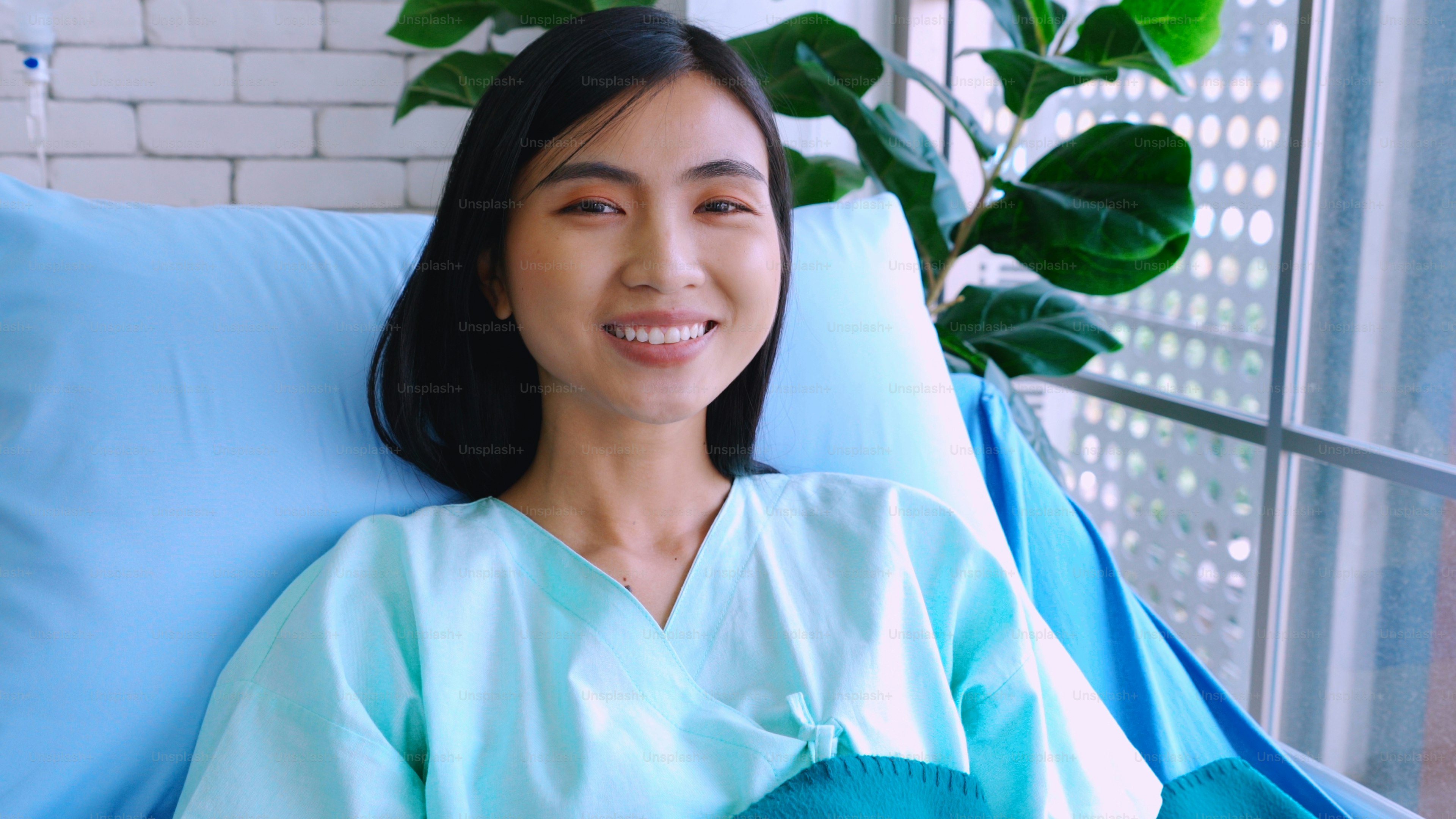 Happy patient getting well improvement at hospital ward . Health care, medical and good hospital service concept.