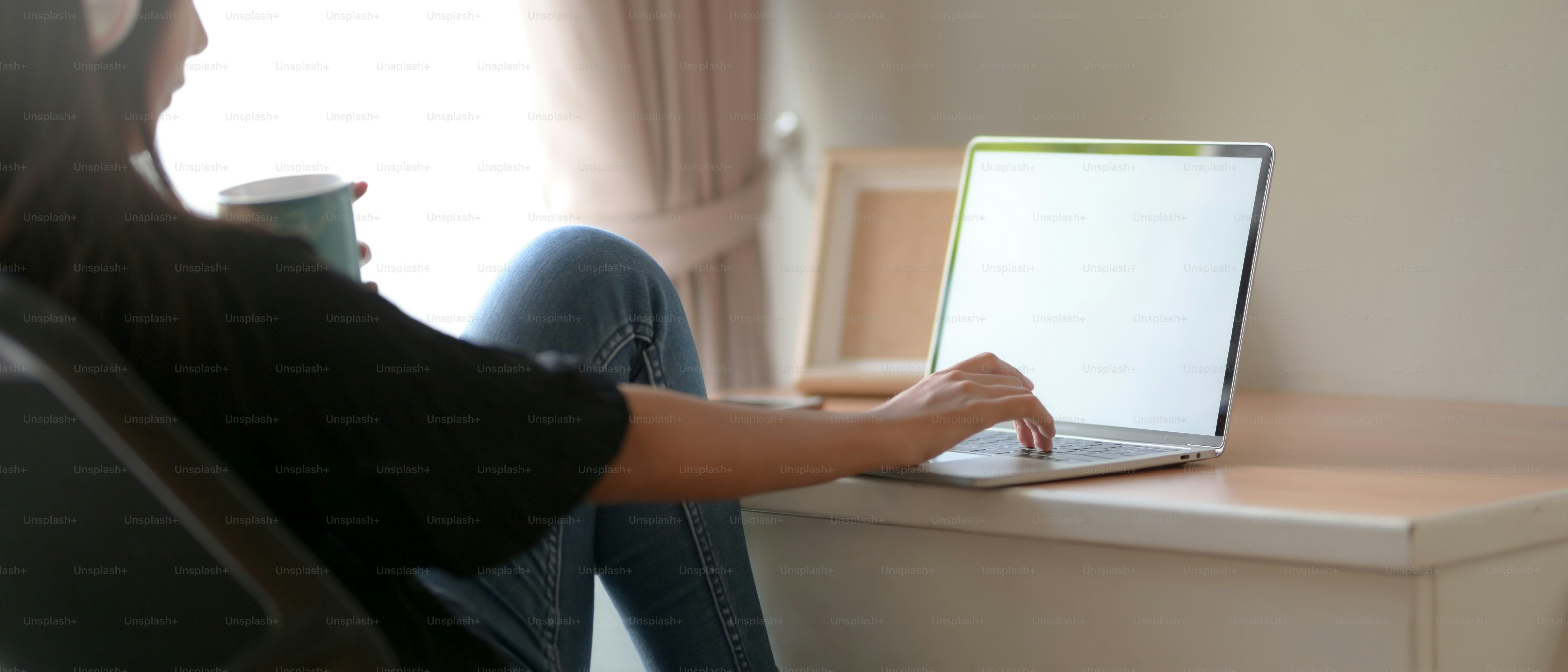 Side view of two college students doing their assignment together with ...