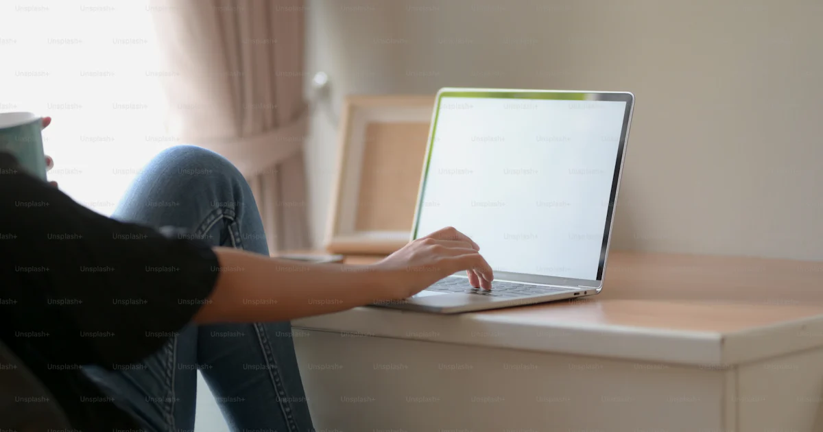 Side view of two college students doing their assignment together with ...