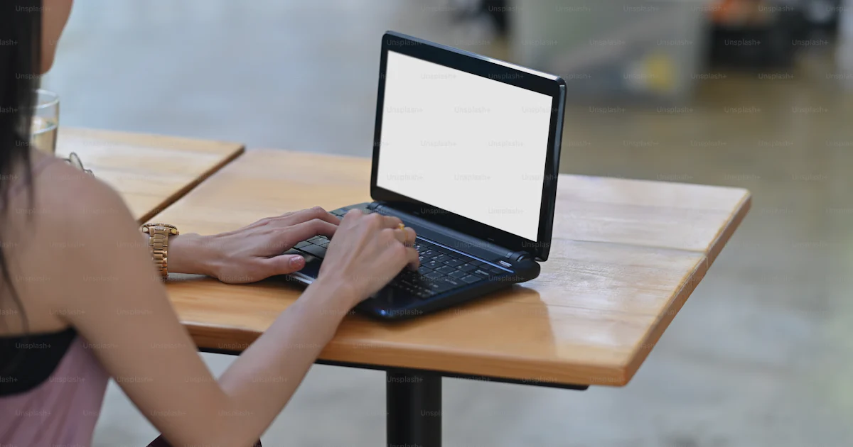 Woman Using Computer No Background Behind shot of beautiful woman is working with a white blank screen ...
