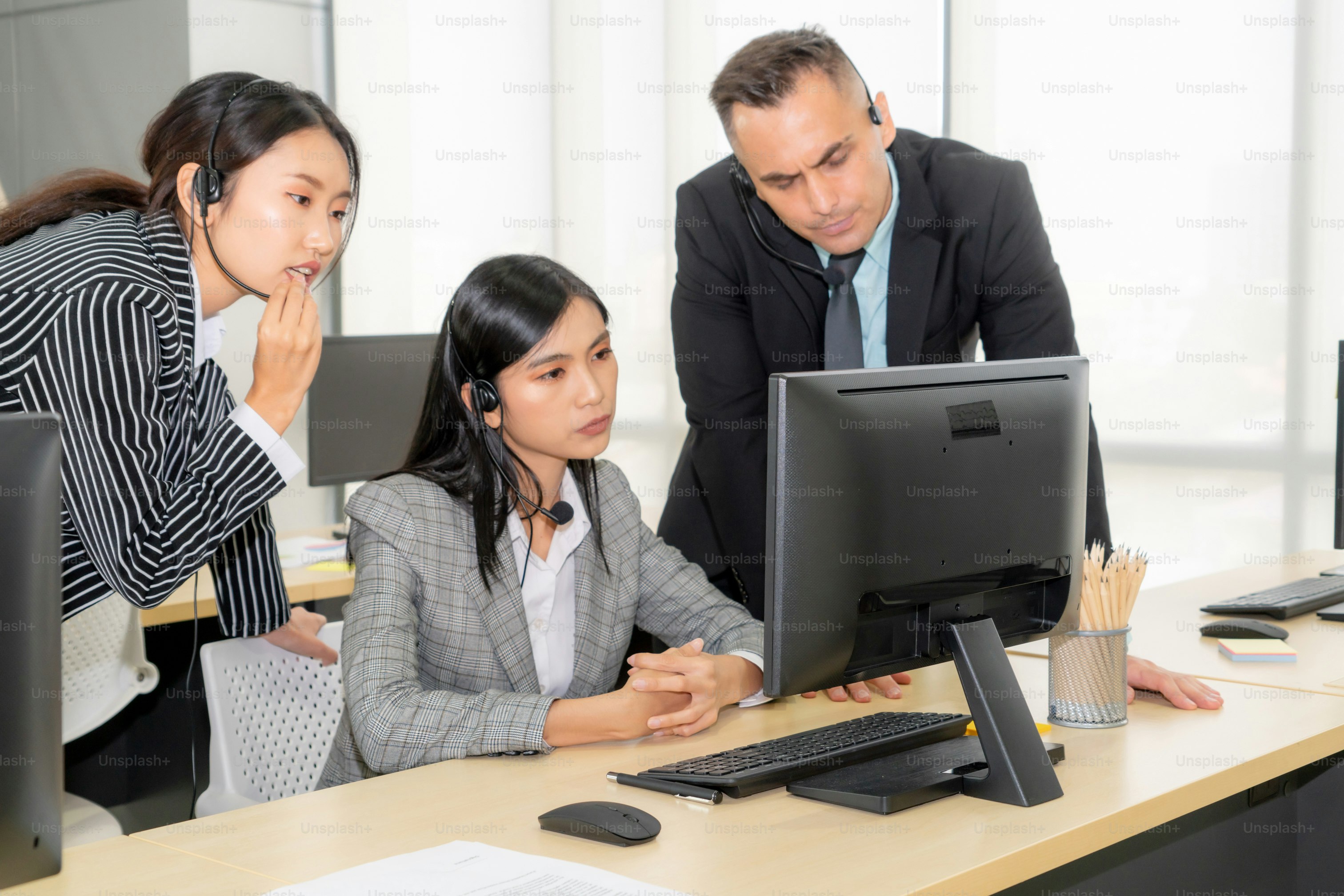 Marketing team analyzing CRM software deals on a customer management dashboard