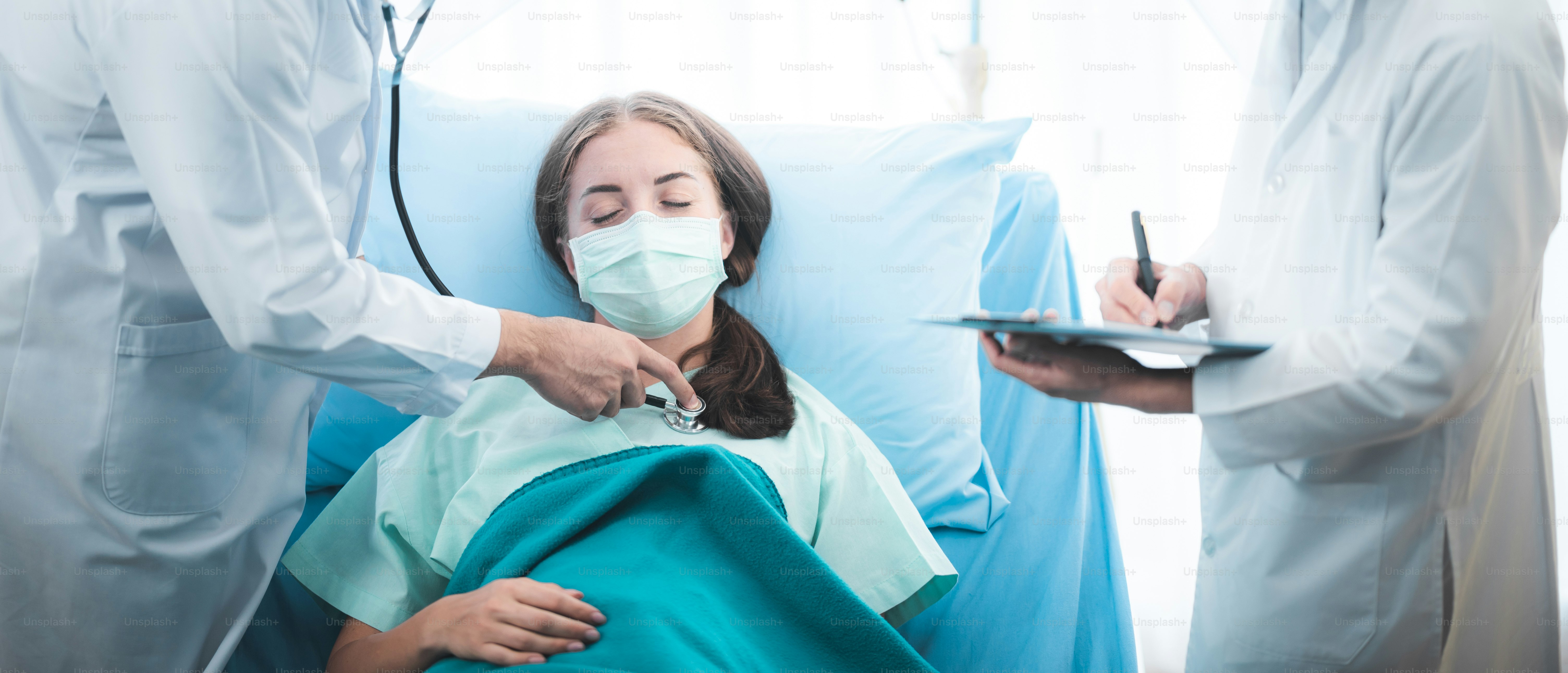 virus control experts doctor working for disease treatment with coronavirus COVID-19 infected patient people in hospital quarantine negative pressure room, PPE suit uniform