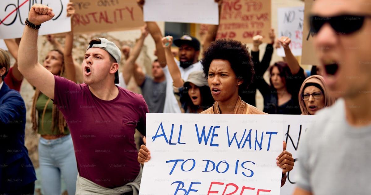 Displeased multi-ethnic crowd of people protesting for human rights on ...