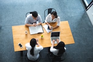 Group of freelance businessman and woman teamwork for the job discussion at the home office co-working space. The support, unity, success and winning concept.