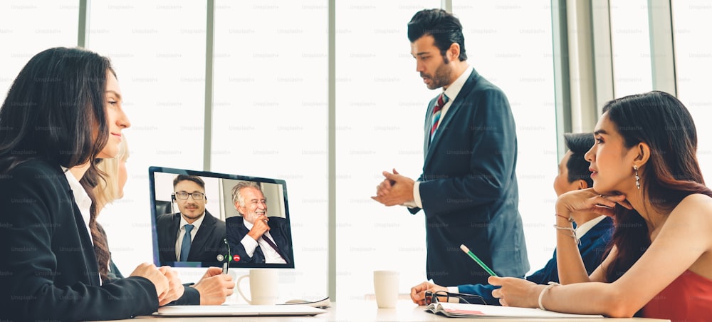 Video call group business people meeting on virtual workplace or remote office. Telework conference call using smart video technology to communicate colleague in professional corporate business.