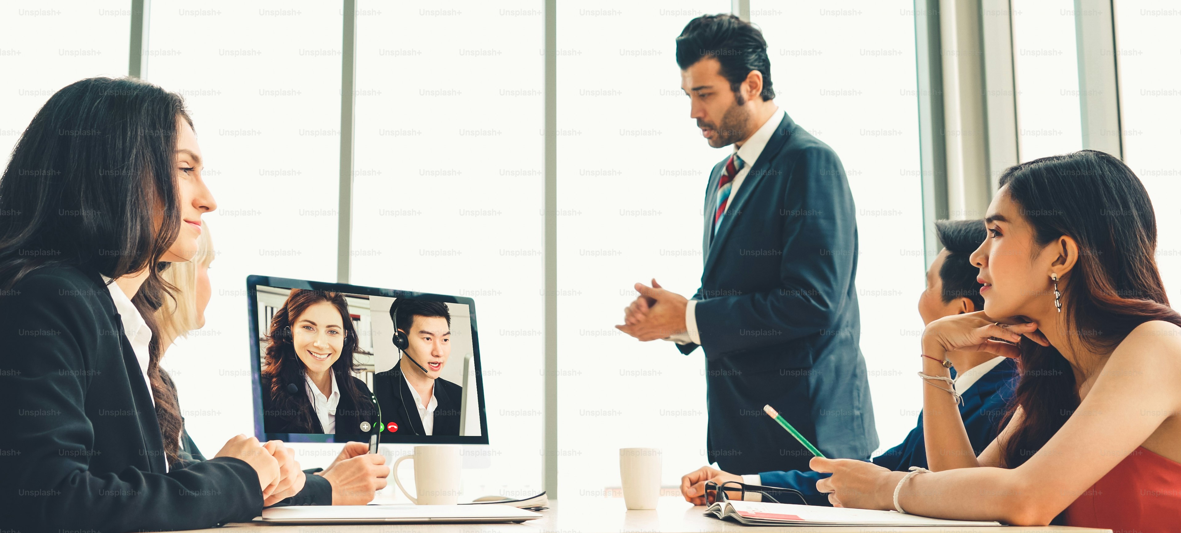 Video call group business people meeting on virtual workplace or remote office. Telework conference call using smart video technology to communicate colleague in professional corporate business.