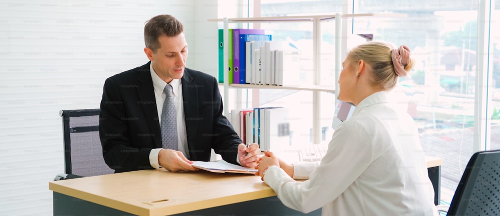 Job seeker in job interview meeting with manager and interviewer at corporate office. The young interviewee seeking for a professional career job opportunity . Human resources and recruitment concept.