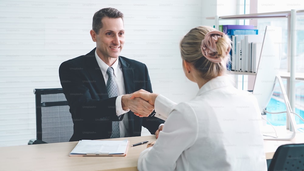 Job seeker in job interview meeting with manager and interviewer at corporate office. The young interviewee seeking for a professional career job opportunity . Human resources and recruitment concept.