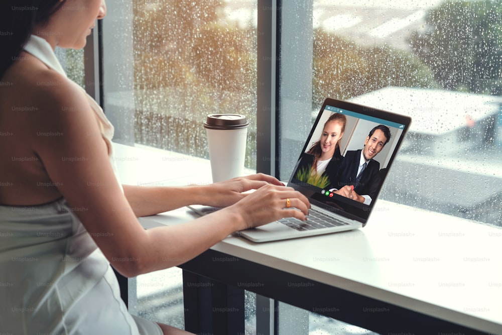 Video call business people meeting on virtual workplace or remote office. Telework conference call using smart video technology to communicate colleague in professional corporate business.