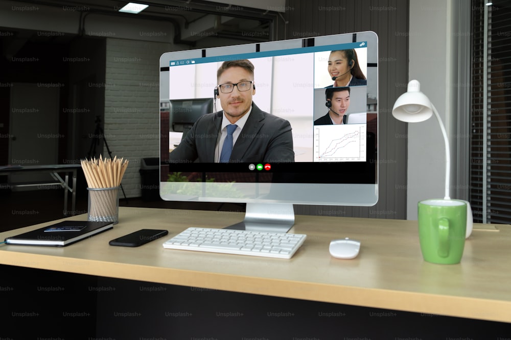 Video call business people meeting on virtual workplace or remote office. Telework conference call using smart video technology to communicate colleague in professional corporate business.