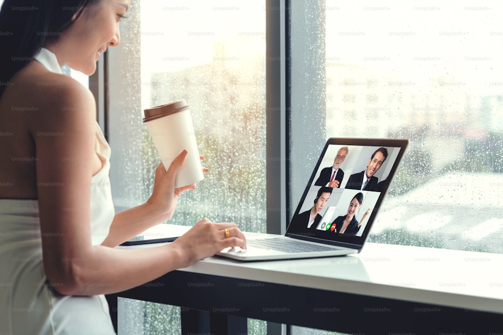 Video call business people meeting on virtual workplace or remote office. Telework conference call using smart video technology to communicate colleague in professional corporate business.